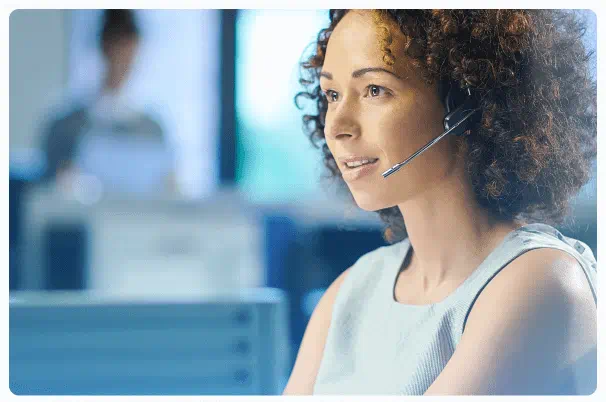 Female support team representative wearing a headset at bloxfxtrade.com offices